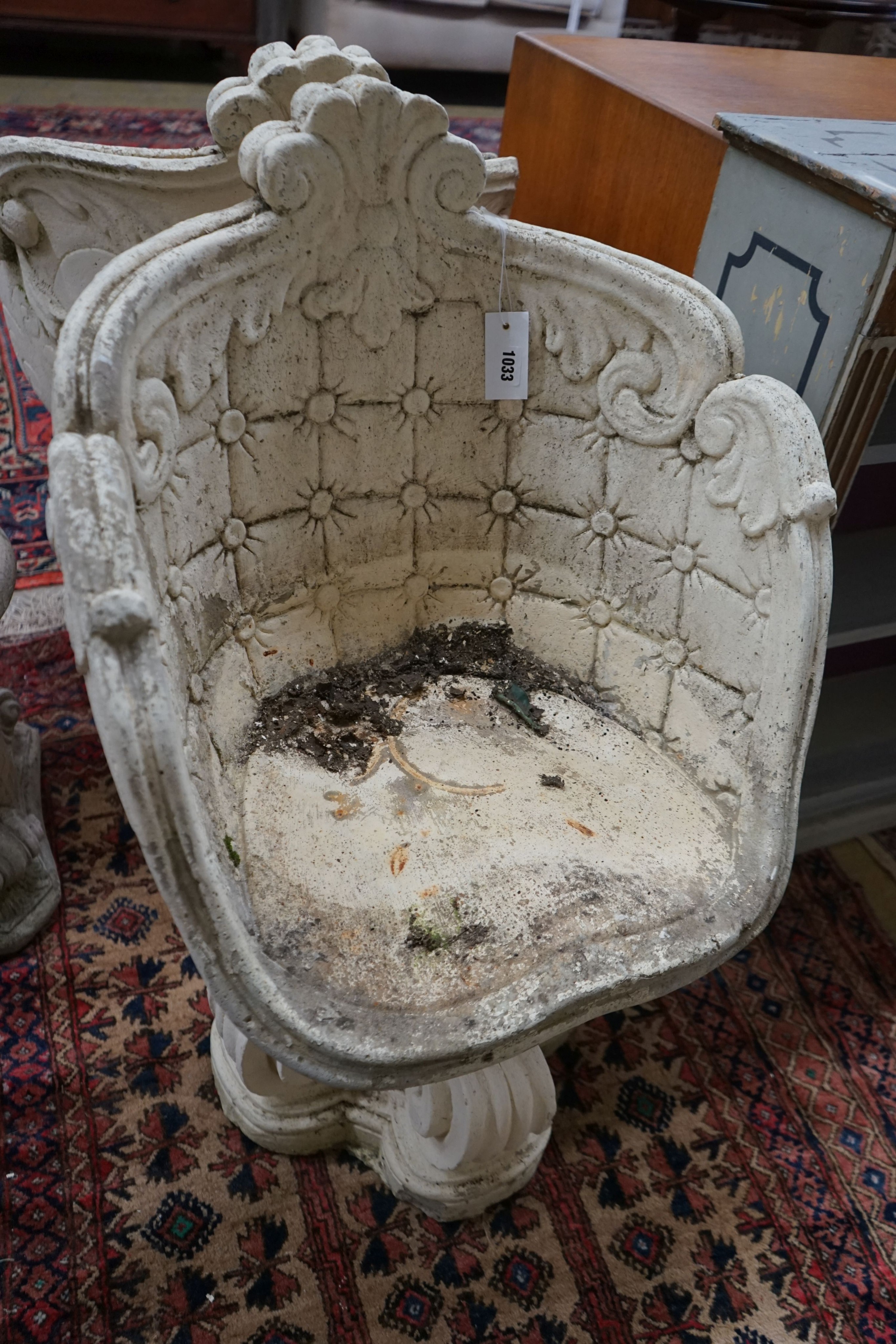 A pair of reconstituted stone tub framed garden chairs, width 55cm, depth 42cm, height 84cm together with a similar low table